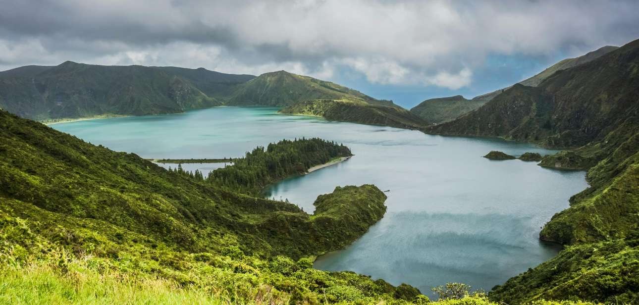 Breathtaking view of Lagoa do Fogo surrounded by lush greenery and mountains in the Azores.